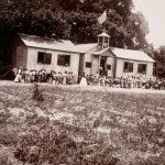 Students and teachers pose outside a National Freedmen’s Bureau school in Beaufort, S.C., in 1865.
