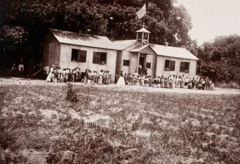 Students and teachers pose outside a National Freedmen’s Bureau school in Beaufort, S.C., in 1865.