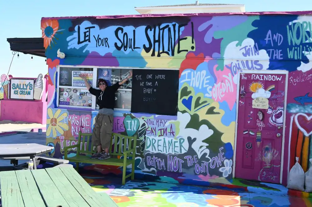 Karen Barchowski has owned Sally's Ice Cream for the past 10 years. She is passing the torch to new owners on Nov. 1. She'd been painting this afternoon when she took a break for a picture. (© FlaglerLive)