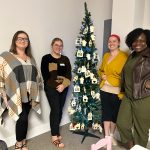 Flagler Cares staff is waiting for contributions to light up more homes. From left, Savannah Prince, Desirae Pace, Danielle Christian, and Grace Manuel. (© FlaglerLive)