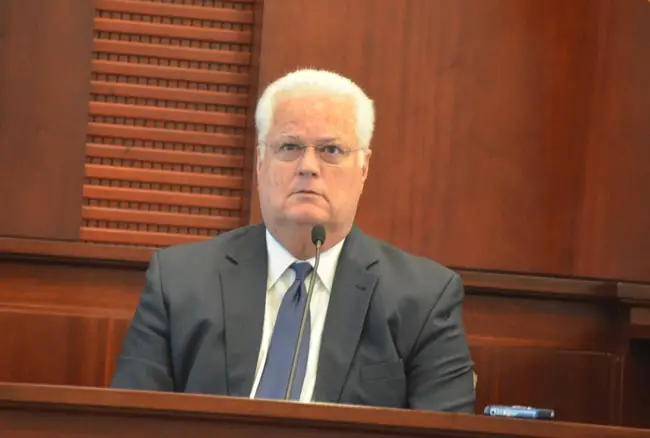 As Florida Secretary of State Ken Detzner, in office since 2012, sat in the witness box today, a Flagler County jury heard a recording of ex-Elections Supervisor Kimberle Weeks call Detzner and one of his his attorneys names. Detzner listened in stunned silence. (© FlaglerLive)