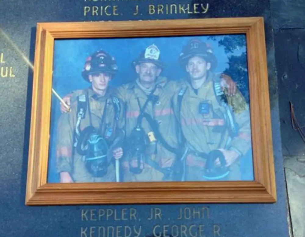 A family photo of John Keppler and his sons, also firefighters, at a state memorial honoring Keppler's line-of-duty death in 2002. (Keppler family)