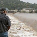 A Kerrville, Texas, resident watches the flooded Guadalupe River on July 4, 2025
