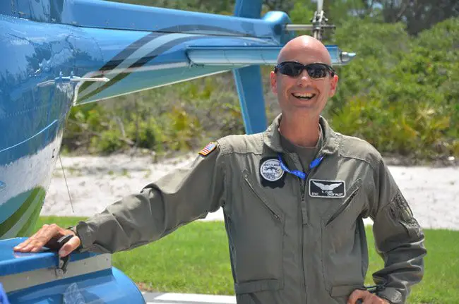 Meet Kevin Card, ace helicopter pilot for the East Flagler Mosquito Control District: that buzzing you hear above isn;t always Flagler County Fire Flight, but Card's helicopter, which he pilots regularly either to survey mosquito populations or to spray. Card is an Embry Riddle Aeronautical University graduate and flew with the Army before joining the district. (© FlaglerLive)