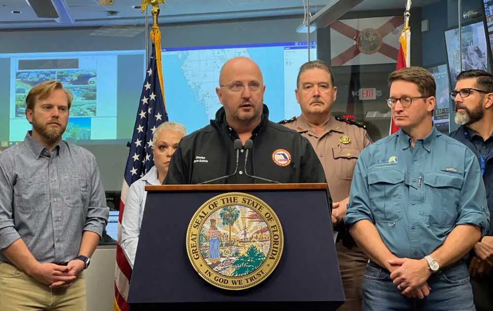 Florida Emergency Management Director Kevin Guthrie addresses reporters on Oct. 3, 2022, at the state Emergency Operations Center, along with other agency heads, including Education Commissioner Manny Diaz, Jr., (to the far right) . Credit: Michael Moline