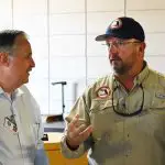 Florida Emergency Management Director Kevin Guthrie, right, with Flagler Beach City Manager William Whitson during Guthrie's last visit to Flagler in mid-October, when he surveyed damage from Hurricane Ian. (© FlaglerLive)