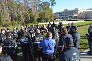 Emergency Services Director Kevin Guthrie, in the center, briefs the responders just before the start of the exercise. Click on the image for larger view. (© FlaglerLive)