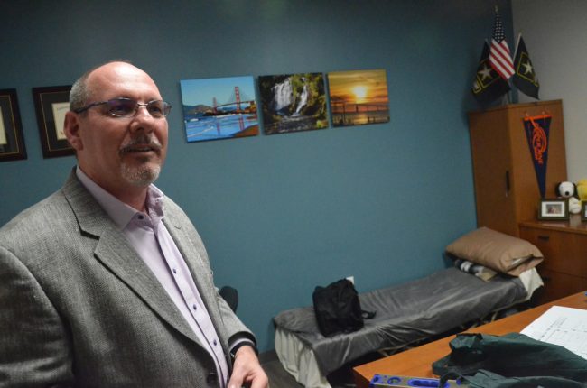 Don Kewley in his office, equipped with a cot for the hackathon. (© FlaglerLive)