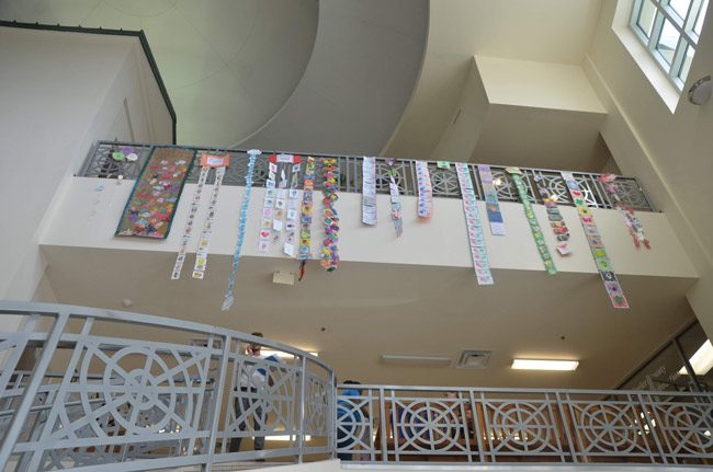 The Government Services Building this week took on a more youthful feel as the Early learning Coalition decorated the lobby with art work by children ahead of Florida Children's Week starting March 24 in Tallahassee, where the art work will be displayed. (© FlaglerLive)