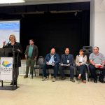 County Commissioner Kim Carney at Tuesday's town hall at the Wickline Center in Flagler Beach, with county administration staffers. (© FlaglerLive)
