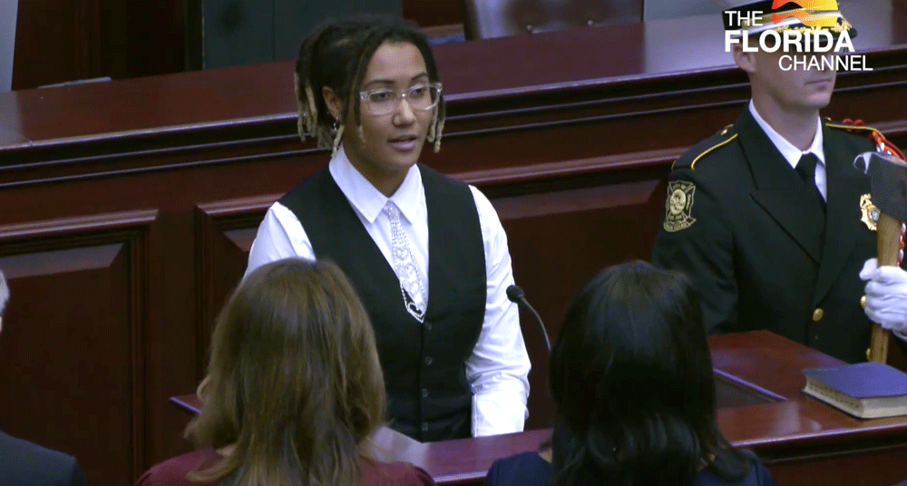 K’imani Gerven-McCoy in the first of two performances of the National Anthem at the Florida Legislature Tuesday, as she stood next to a color guard from the Palm Coast Fire Department. Gerven-McCoy and the color guard were guests of Paul Renner, the House Speaker who also represents Flagler County. (Florida Channel)