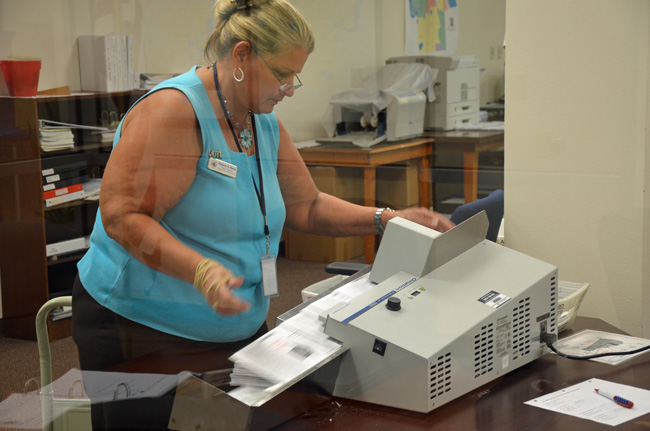 Accuracy, anyone? Supervisor of Elections Kimberle Weeks during a Canvassing Board operation today. (© FlaglerLive)