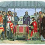 King John of England signs the Magna Carta in 1215.