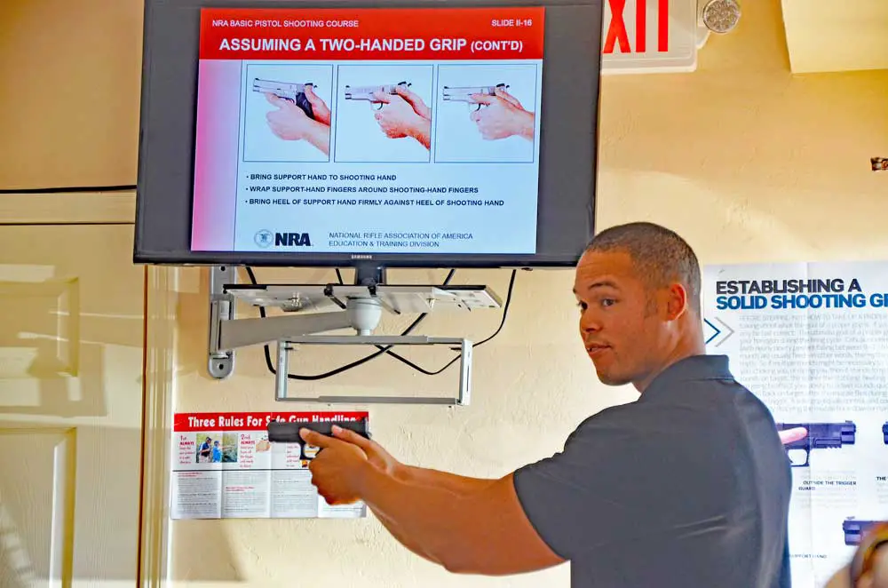 Kirk Chong of Larry's Guns and Ammo in Bunnell teaches gun-safety classes several times a month. He says an individual must be confident about his or her ability to own a gun. If not, the individual should seek less-lethal alternatives. (© FlaglerLive)