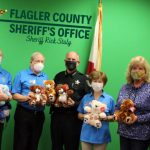 Members of the Kiwanis Club with Flagler County Sheriff Rick Staly and the Kiwanis's latest donation of stuffed bears. (Kiwanis)