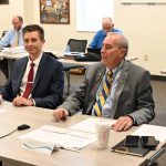 Palm Coast City Council member Nick Klufas, left, attempted earlier this week to have negotiations with the Green Lion Cafe reopened. His motion failed on a 3-2 vote. Mayor David Alfin, right, voted against Klufas's motion. The two council members are seen here at a meeting this morning unrelated to that issue. (© FlaglerLive)