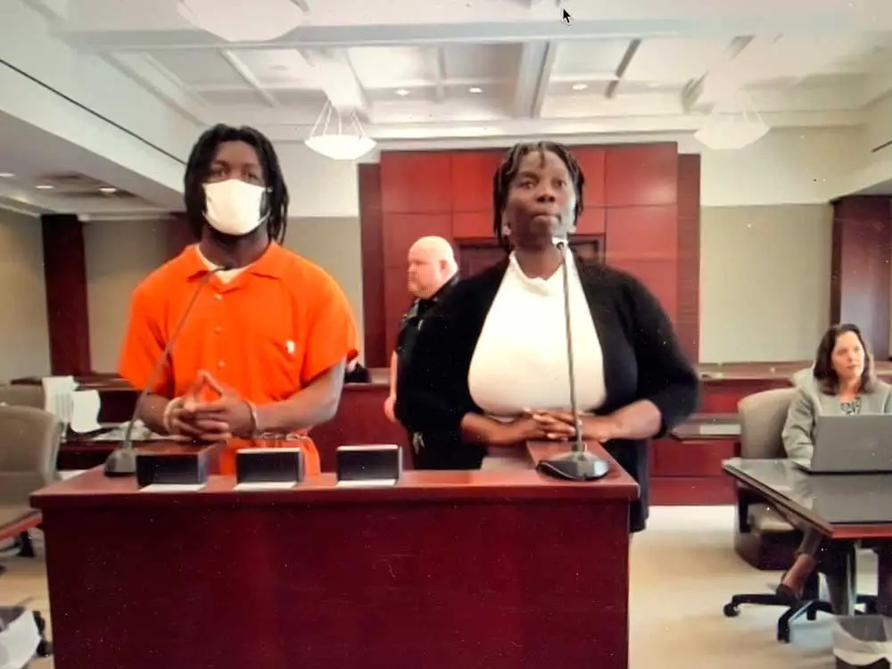 Kwentell Moultrie with Assistant Public Defender Regina Nunnally this morning, appearing before Circuit Judge Terence Perkins. Moultrie had made a motion for speedy trial, then revoked it. (© FlaglerLive via zoom)