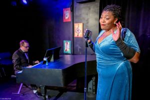Laniece Fagundes is Billie Holiday and Ben Beck is pianist Jimmy Powers in City Repertory Theatre’s production of “Lady Day at Emerson’s Bar and Grill.” Photo by Mike Kataif
