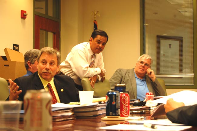 State Attorney R.J. Larizza, Joel Bolante, chief of staff at the St. Johns County Sheriff’s Office and Flagler County Sheriff Don Fleming, during a break between interviews for a new medical examiner. Interviews took place at the St. Johns County administrative building all day on Wednesday. (FlaglerLive)