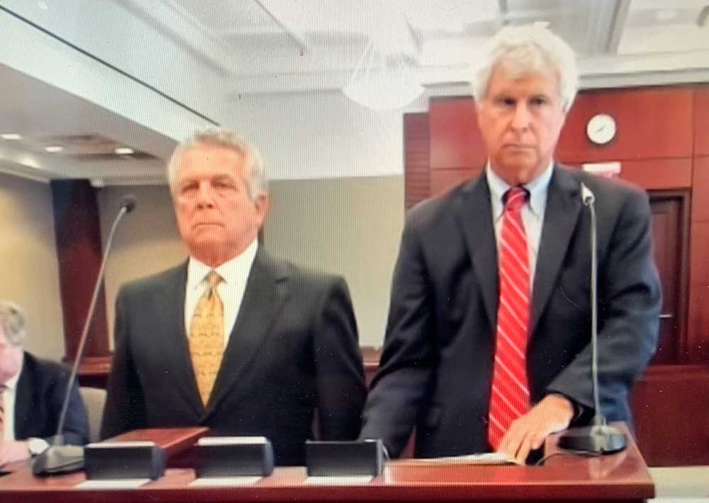 Larry Cavallaro, left, in court this afternoon with his attorney, Warren Lindsey. (© FlaglerLive via zoom)