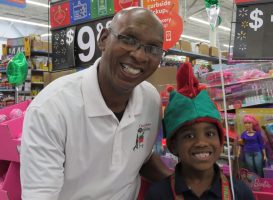 Larry Jones with one of the children in a 2018 shopping spree. (Facebook)