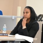Superintendent LaShakia Moore at a recent workshop of the School Board. Her wristband reads: "You Are Enough." (© FlaglerLive)