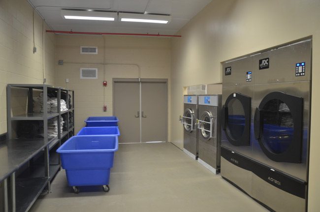 The laundry room at the Flagler County jail. Allegations of misconduct by deputies involved female inmates working laundry duty. (© FlaglerLive)