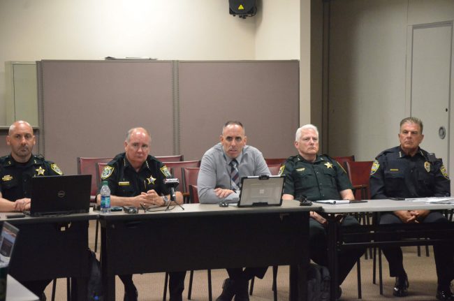 Don't mess with Flagler: from left, Chief Chris Sepe, Sheriff Rick Staly, Chiefs Paul Bovino and Mark Strobridge, and Bunnell Police Chief Tom Foster. Click on the image for larger view. (© FlaglerLive)