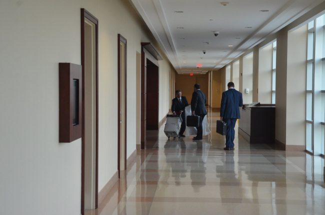 The Wykretowicz team of lawyers leaving at the end of the day: Sam Masters, left, Aaron Delgado and John Reed. (© FlaglerLive)