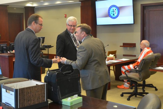 The lawyers at the end of today's hearing. From left, Assistant State Prosecutor Mark Johnson, Assistant Public Defender Ray Warren, Doug Williams, and Paul Miller. Click on the image for larger view. (© FlaglerLive)