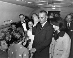 LBJ taking the oath after the assassination, with Jackie Kennedy to his left. Click on the image for larger view. 