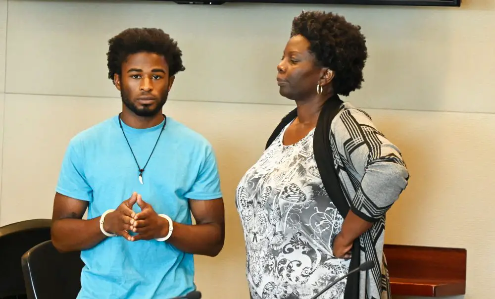 In the words of Mario Balotelli: "Why always me?" L'Darius Smith with his attorney, Assistant Public Defender Regina Nunnally. (© FlaglerLive)