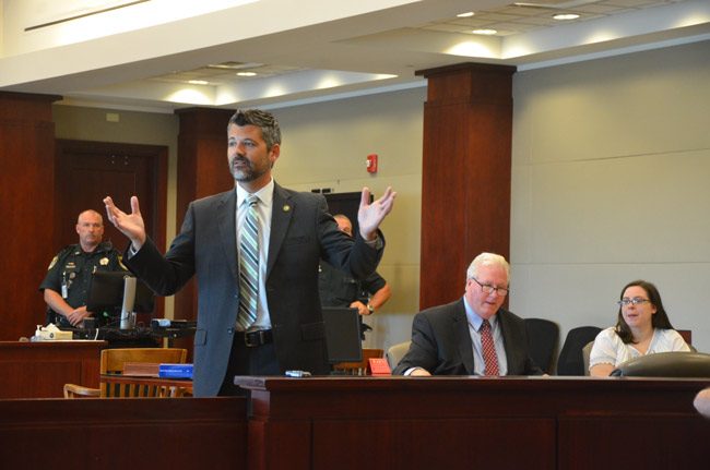 Assistant State Attorney Joe LeDonne addressing the jury pool today in jury selection for the trial of Erin Vickers, who sat to the right, next to her attorney, Garry Wood. (© FlaglerLive)