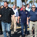 From left, Gov. Ron DeSantis, hen-Flagler Beach City Manager William Whitson, Tom Leek, and Paul Renner in Flagler Beach in October 2022. (© FlaglerLive)