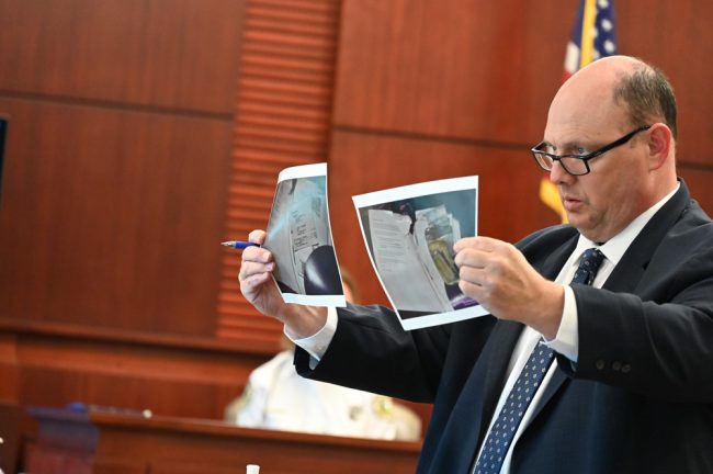 Defense attorney Terence Lenamon showing documents Jarod Humphrey left behind in Derrius Bauer's car. (© FlaglerLive)