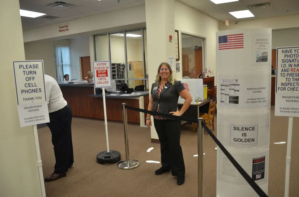 Flagler County Elections Supervisor Kaiti Lenhart during a more normal election, in 2017, at the early-voting site at her office in Bunnell. (© FlaglerLive)