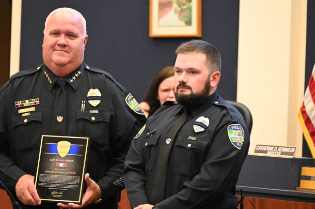 Officer Micheal Fansler with Chief Brannon. (© FlaglerLive)