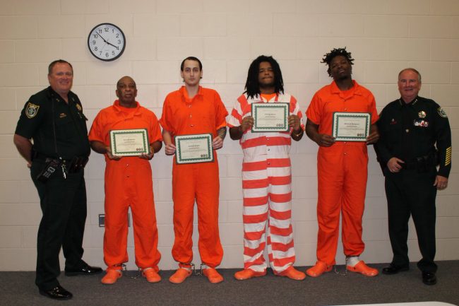 Four inmates helped detention deputies save the life of a fellow inmate on February 12 when the inmate tried to hang himself from the stairwell. Staly presented those inmates with Life Saving awards for their heroic actions.  From left: Chief Steve Cole, Gerald Smith, Joshua Keyes, Phillip Haire, Edward Sampson, and Sheriff Staly.