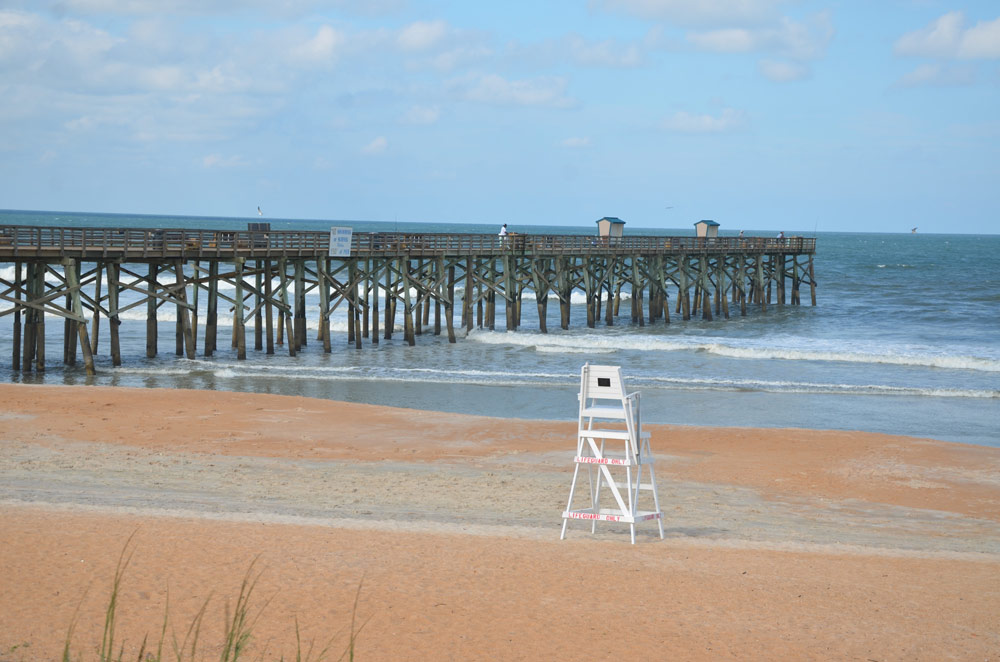 The good old days when the pier was walkable and lifeguards' future was not in question. (© FlaglerLive)