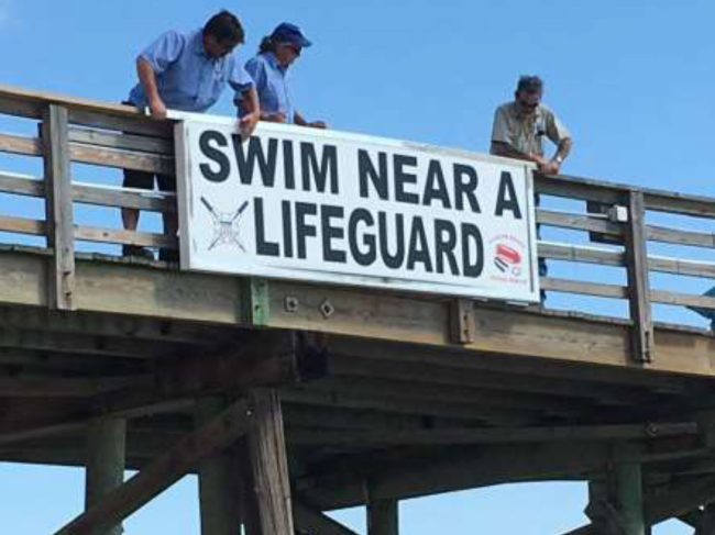 The sign can be flipped to read "No Lifeguard on Duty" after 5:15 p.m. (Flagler Beach)
