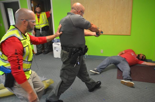 A Flagler County sheriff's deputy takes out a mass shooter during training today at Community Baptist Church in Korona. (© FlaglerLive)