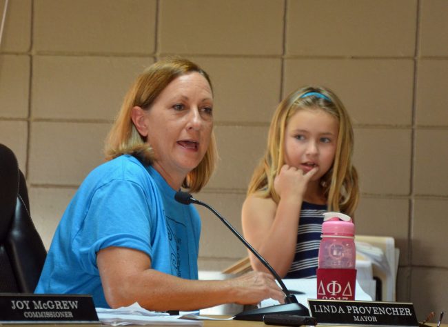 The Kids Town Hall was the idea of Linda Procencher and the All Stars, Eric Cooley and Carla Cline, whose daughter, Penelope McDonald, 7, chose to attend the meeting at the mayor's side. Click on the image for larger view. (© FlaglerLive)