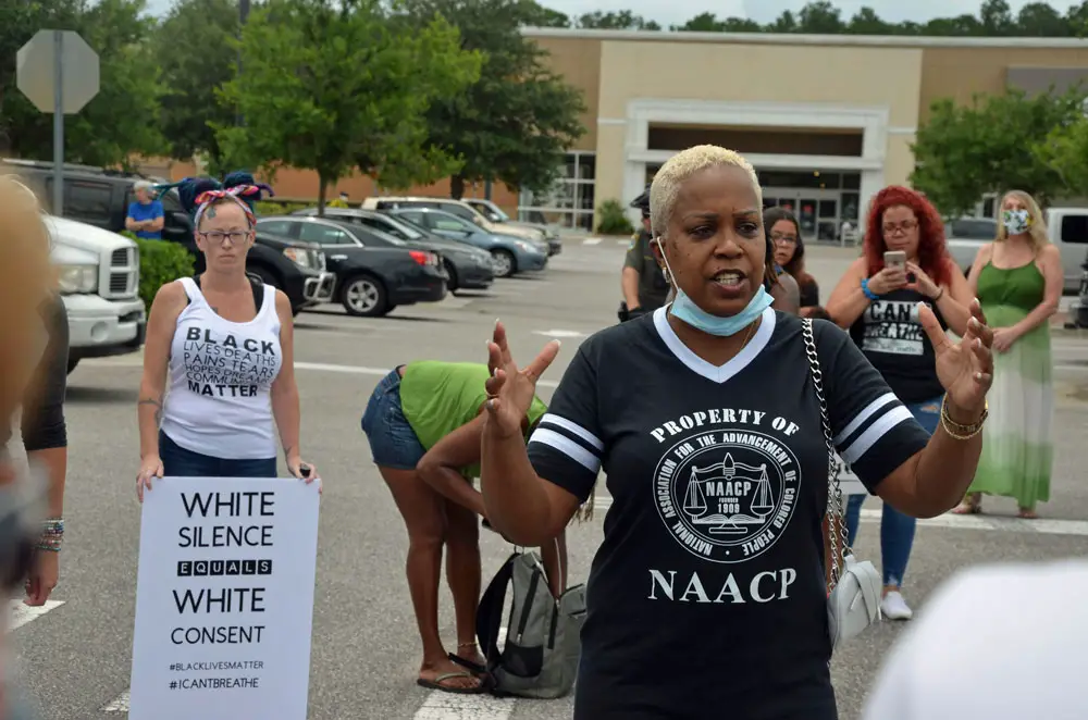 Linda Sharpe-Matthews, who heads the Flagler Branch of the NAACP, at a Black Lives Matter march in June in Palm Coast, will be among the speakers at Friday's motorized march. (© FlaglerLive)