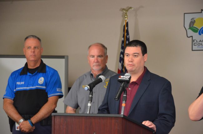 Flagler Emergency Management Chief Jonathan Lord at this morning's press conference, with Sheriff Rick Staly and Flagler Beach Police Chief Matt Doughney. (© FlaglerLive)