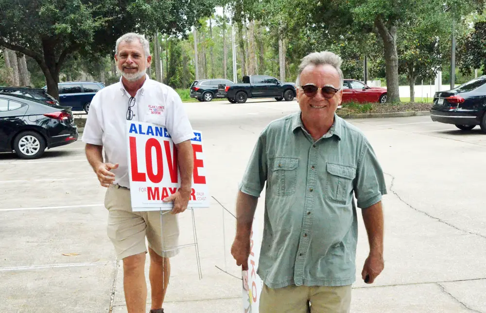 Ed Danko, the Palm Coast City Council member, in the foreground, has been campaigning on behalf of Alan Lowe, left, and advising or managing his campaign--a campaign using false and misleading accusations as a talking point. (© FlaglerLive)