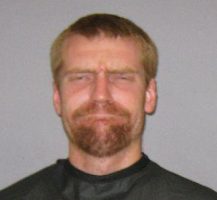 Lucas Gore in a 2011 booking photo at the county jail, where he'd been booked on a battery charge filed by his brother after Lucas had pushed his brother's girlfriend. 