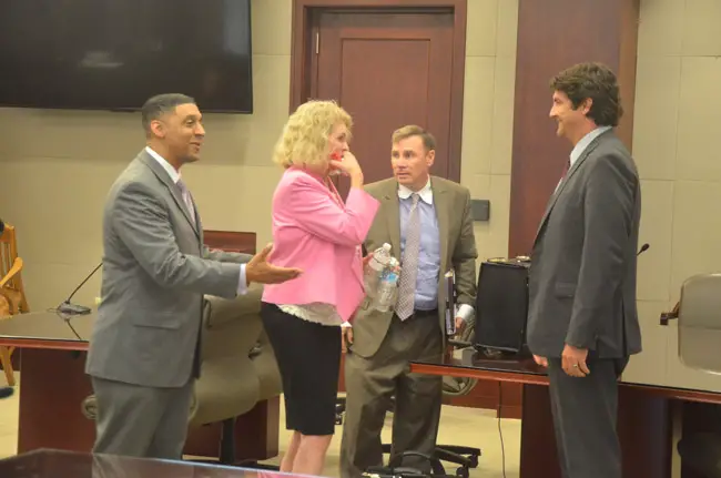 Lucille Horton with her lawyers after the verdict late this afternoon. From left, Marc Dwyer, Doug Williams and Ron Hertel. (© FlaglerLive)