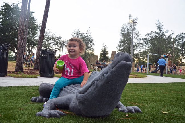 Lucy David, 21 months old, gets acquainted with Holland Park. (© FlaglerLive)