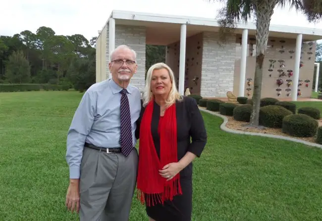 Allen Whetsell and Donna Lundsford on the grounds of Craig Flagler Palms. 