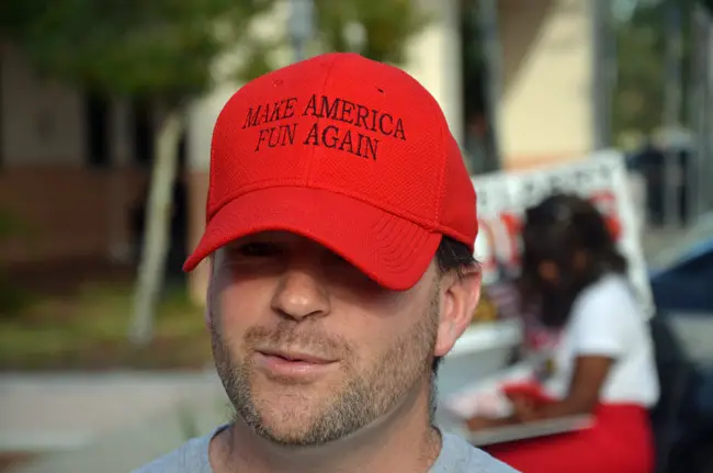 Matthew Moss, a 35-year-old Palm Coast resident and George Carlin fan, was with candidates at the Flagler County Public Library today. (© FlaglerLive)